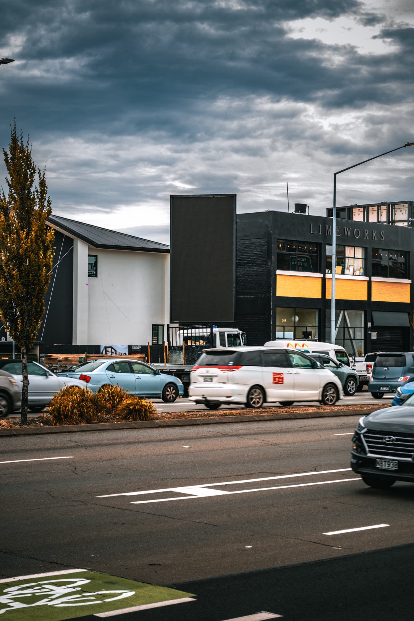 Street traffic passing an installed digital billboard